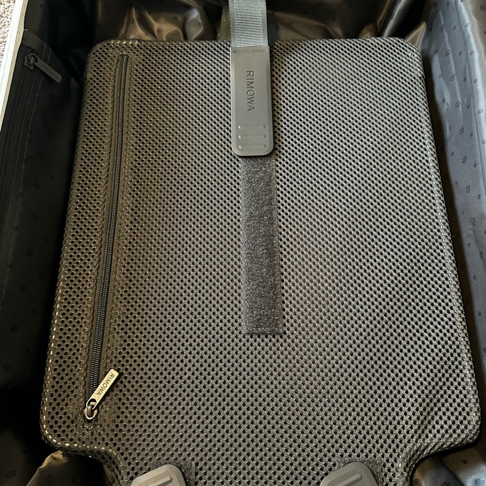 Brand new rimowa carry on luggage comes with book and dust bag.